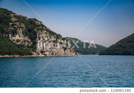 Panoramic tour old town of Rovinj, Lim Fjord, Croatia. Aquaculture fish farm mountainous setting. Panoramic tour old town of Rovinj, Lim Fjord, Croatia. Aquaculture fish farm mountainous setting. 128061390