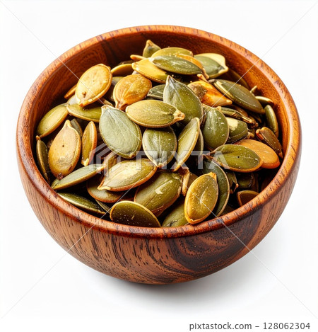 Roasted Pumpkin Seeds in Wooden Bowl 128062304