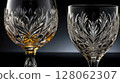 Crystal glasses with floral decorations shining on dark background 128062307