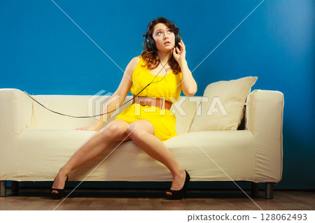 girl in headphones listening music mp3 relaxing 128062493