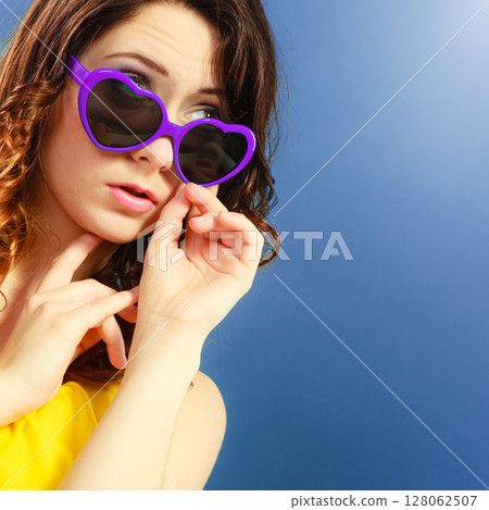 Girl in violet sunglasses portrait Girl in violet sunglasses portrait 128062507