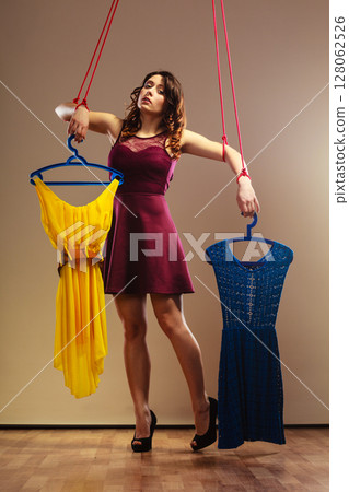 Addicted to shopping woman girl marionette with clothes 128062526