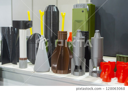 Plastic grenade body and shank stabilizer printed on 3D printer from melted plastic. Grenade created on 3D printer. Prototype of ammunition printed on 3D printer. Innovation 3d printing. Innovation Plastic grenade body and shank stabilizer printed on 3D printer from melted plastic. Grenade created on 3D printer. Prototype of ammunition printed on 3D printer. Innovation 3d printing. Innovation 128063068