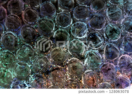Absract background of shiny plastic and bubbles dreating bright sci-fi style texture background 128063078