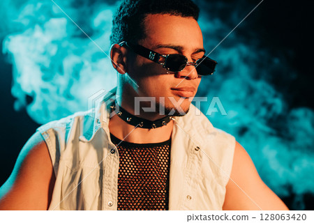 Stylish Man Dressed In Net In Neon Light, Smoke Studio Or In Night Club Stylish Man Dressed In Net In Neon Light, Smoke Studio Or In Night Club 128063420
