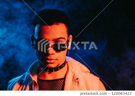 Glamourous Man In Smoke Neon Green Light, Night Club. Portrait Sexy Guy In Smoke Glamourous Man In Smoke Neon Green Light, Night Club. Portrait Sexy Guy In Smoke 128063421