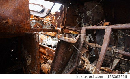 Rusty and burned-out armored vehicles on ukrainian territory. Exhibition of destroyed military equipment of the russian army. War between Ukraine and russia. Close up Slow motion 128063516