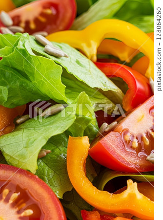 Colorful Fresh Salad with Tomatoes Bell Peppers and Sunflower Seeds Colorful Fresh Salad with Tomatoes Bell Peppers and Sunflower Seeds 128064260