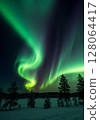 Vibrant Green Aurora Borealis over Snowy Winter Landscape 128064417