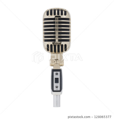 Vintage style microphone with metallic grille and classic design evokes nostalgia. It features sleek handle and retro aesthetics, ideal for performances or recordings Vintage style microphone with metallic grille and classic design evokes nostalgia. It features sleek handle and retro aesthetics, ideal for performances or recordings 128065377