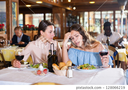 Young couple quarreling during dinner at restaurant 128066219