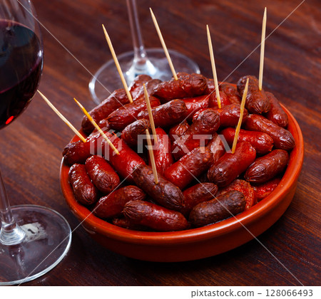 Spanish appetizer, warm mini chorizo sausages Spanish appetizer, warm mini chorizo sausages 128066493