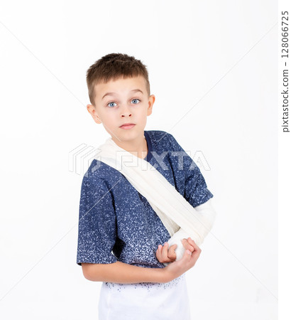 Portrait boy hand bandage isolated white background, child hand injury bandage dressing, broken hand 128066725