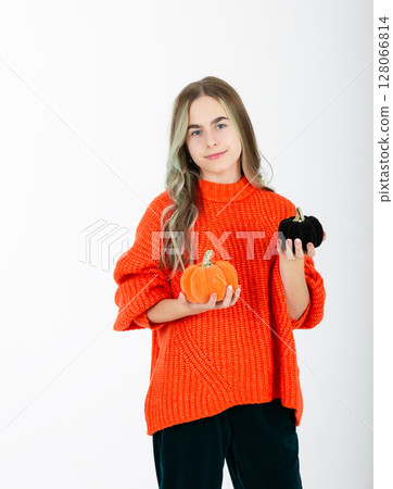 Portrait smiling girl in orange clothes, with pumpkin jack sweet candy. Isolated white background 128066814