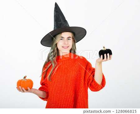Portrait smiling girl in witch black hat, with pumpkin jack sweet candy. Isolated white background Portrait smiling girl in witch black hat, with pumpkin jack sweet candy. Isolated white background 128066815