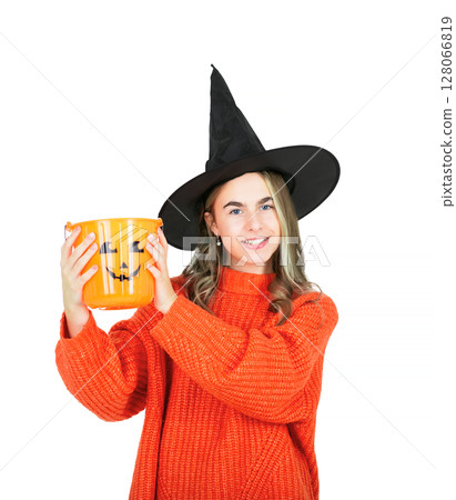 Portrait smiling girl in witch black hat, with pumpkin jack sweet candy. Isolated white background 128066819