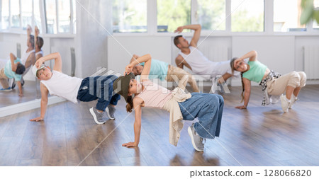 Group of children dancers having break dance training at dance studio Group of children dancers having break dance training at dance studio 128066820