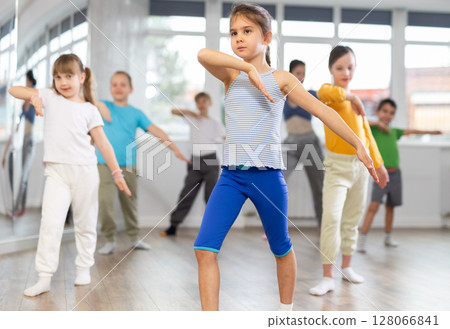 Group of children dancing modern dances Group of children dancing modern dances 128066841
