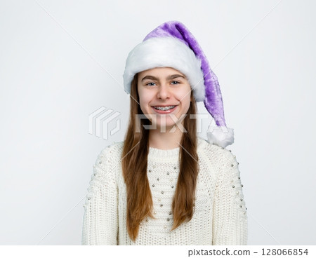 Girl Santa hat showing joy, delight, surprise, approval. Happy emotions, joy Christmas concept. 128066854