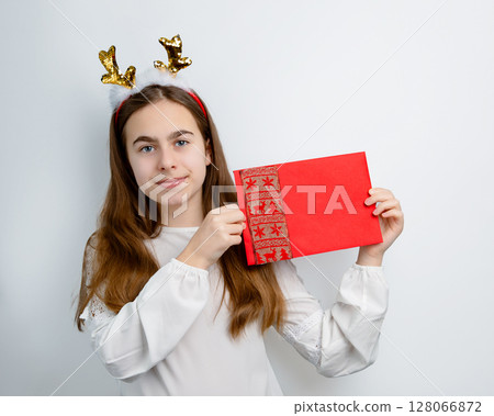 Girl reindeer antlers holding envelope, postcard, greeting, letter Santa different funny emotions Girl reindeer antlers holding envelope, postcard, greeting, letter Santa different funny emotions 128066872