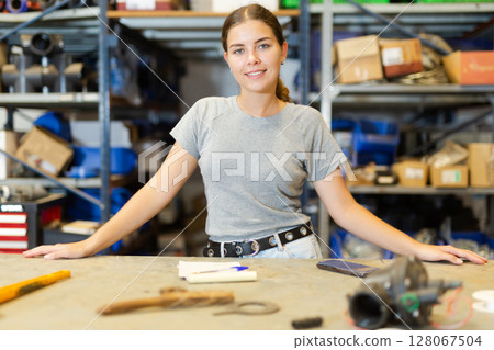 Portrait of positive girl warehouse worker Portrait of positive girl warehouse worker 128067504