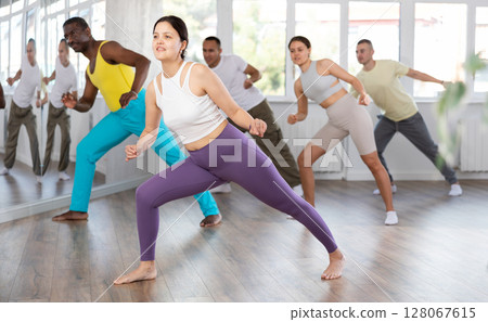 Group of people dancing modern dances 128067615