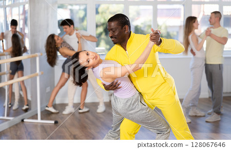 Adult man and woman dancing latin dances 128067646