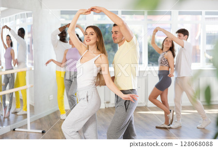 Couple young woman and man dancing waltz 128068088