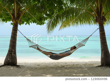 A man resting on the beach with a hammock 128068496