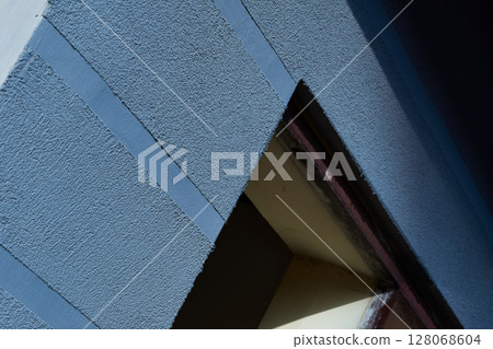 Blue gray freshly plastered wall with doorway 128068604
