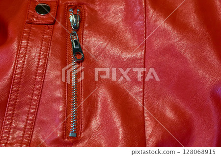 Zippered pocket on a red leather jacket Zippered pocket on a red leather jacket 128068915