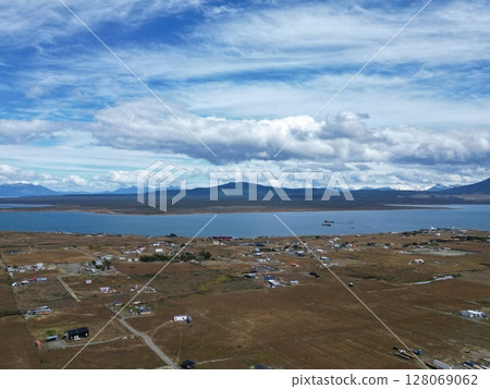 Aerial view of the town of Puerto Natales on the east bank of the Senoret Canal Aerial view of the town of Puerto Natales on the east bank of the Senoret Canal 128069062