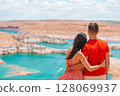 Young couple enjoying the view Lake Powell, Glen Canyon National Recreation Area 128069937
