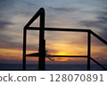 Morning sun and the silhouette of the embankment railing 128070891