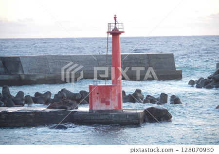 Red lighthouse and sunrise Red lighthouse and sunrise 128070930