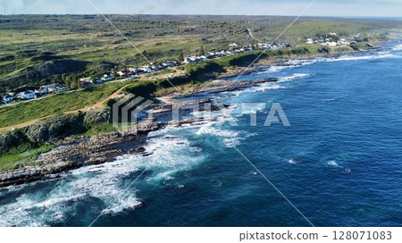 Elevated Vantage Over Cliffside Village and Roaring Surf Elevated Vantage Over Cliffside Village and Roaring Surf 128071083