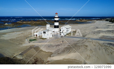 Solitary Beacon Guarding Wind-Swept Coastal Sands 128071090