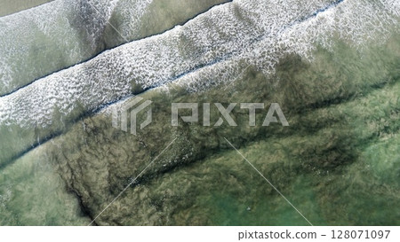 Aerial Abstraction of Foamy Turquoise Ocean Currents 128071097