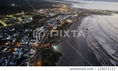 Twilight Illumination Over Coastal Village Twilight Illumination Over Coastal Village 128071113