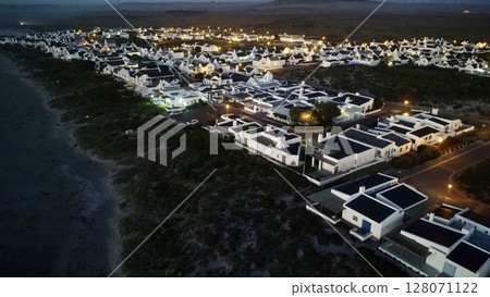 Twilight Illumination Over Coastal Village Twilight Illumination Over Coastal Village 128071122