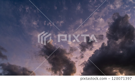 Many clouds flowing in the blue sky at dusk Many clouds flowing in the blue sky at dusk 128071397