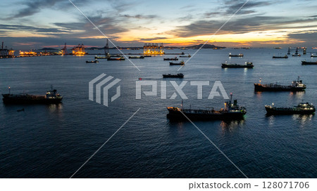 Aerial view oil tanker ship and gas tanker ship at sunset, Silhouette oil and gas tanker ship at oil and gas terminal, Global business import export logistic transportation oil and gas petroleum. 128071706