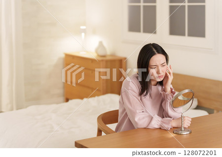 Women suffering from skin trouble Women suffering from skin trouble 128072201