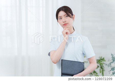 Thinking female nurse Thinking female nurse 128072209