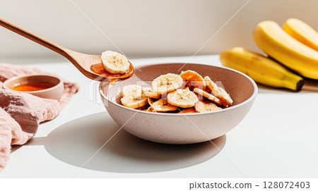 Crispy banana chips with honey drizzled, a delightful plant-based snack experience Crispy banana chips with honey drizzled, a delightful plant-based snack experience 128072403
