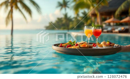 A luxurious floating tray filled with drinks and food, elegantly placed on a table by the pool, perfect for relaxation A luxurious floating tray filled with drinks and food, elegantly placed on a table by the pool, perfect for relaxation 128072476