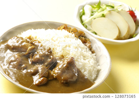 Hot chicken curry with chunks of chicken and potato salad Hot chicken curry with chunks of chicken and potato salad 128073165