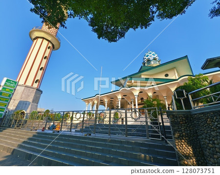 Kediri, East Java Indonesia - July 02 2025: The great mosque of the Kediri city (Masjid Agung Kediri) with clear blue sky background, 128073751