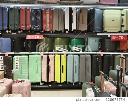 Indonesia,Kediri East Java june, 25 2025-An assortment of suitcases in hard and soft cases on display in a retail store chain 128073754
