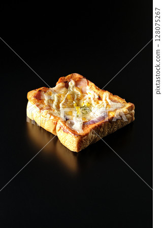Pizza toast photographed alone on a black background 128075267